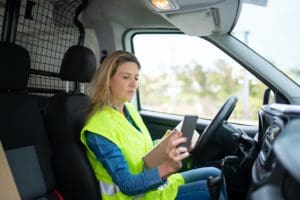 self-employed courier driver jobs - driver scanning a parcel